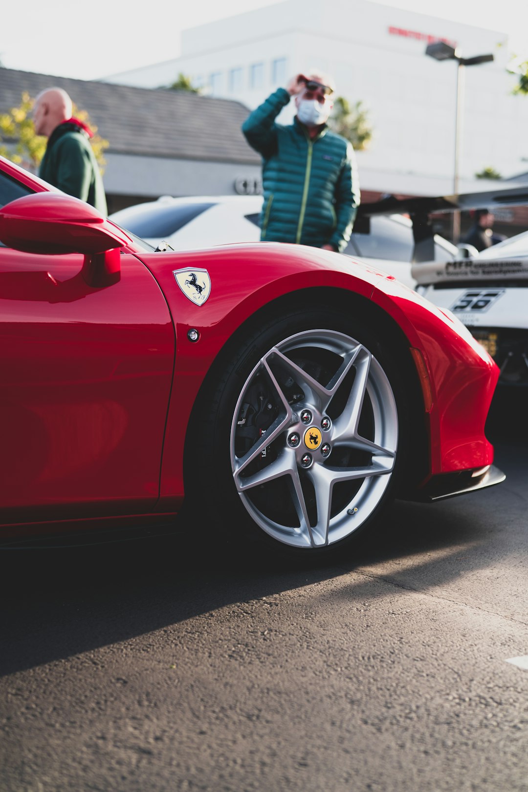 red ferrari 458 italia parked on parking lot