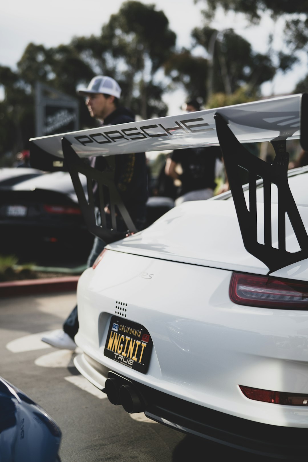 white porsche 911 parked in garage