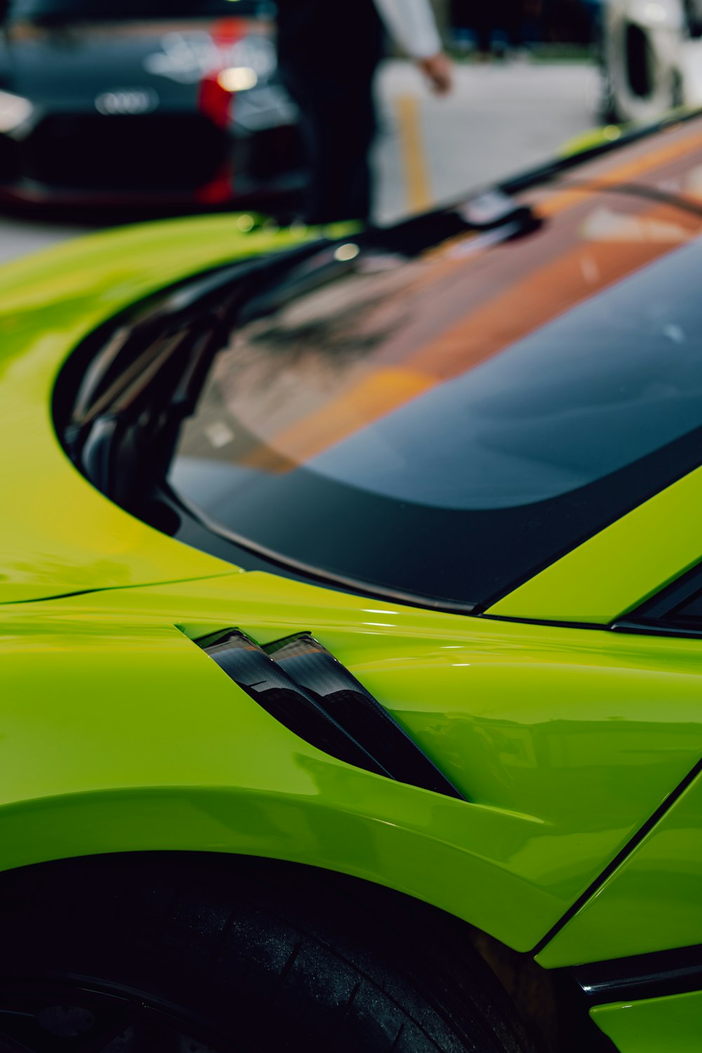 yellow and black car in a parking lot