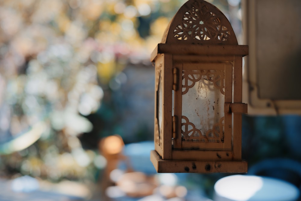 brown wooden candle lantern in tilt shift lens