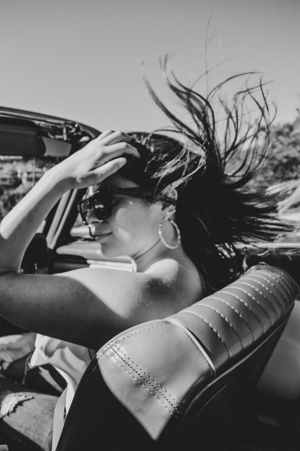 grayscale photo of woman in white brassiere