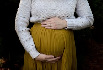 woman in white long sleeve shirt and yellow skirt