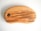 A wooden cutting board with a smooth, rounded shape and a large hole on one end. The wood grain is visible, showing natural brown and beige tones. A brand logo is etched into the bottom right corner with the words 'WOODTOUCH Australia' and an image of a tree.