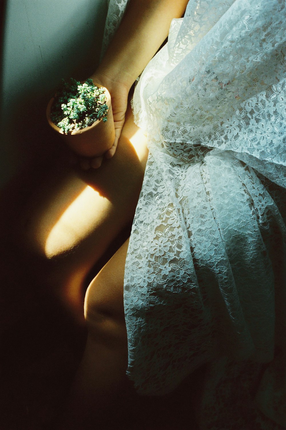 woman in white floral lace dress