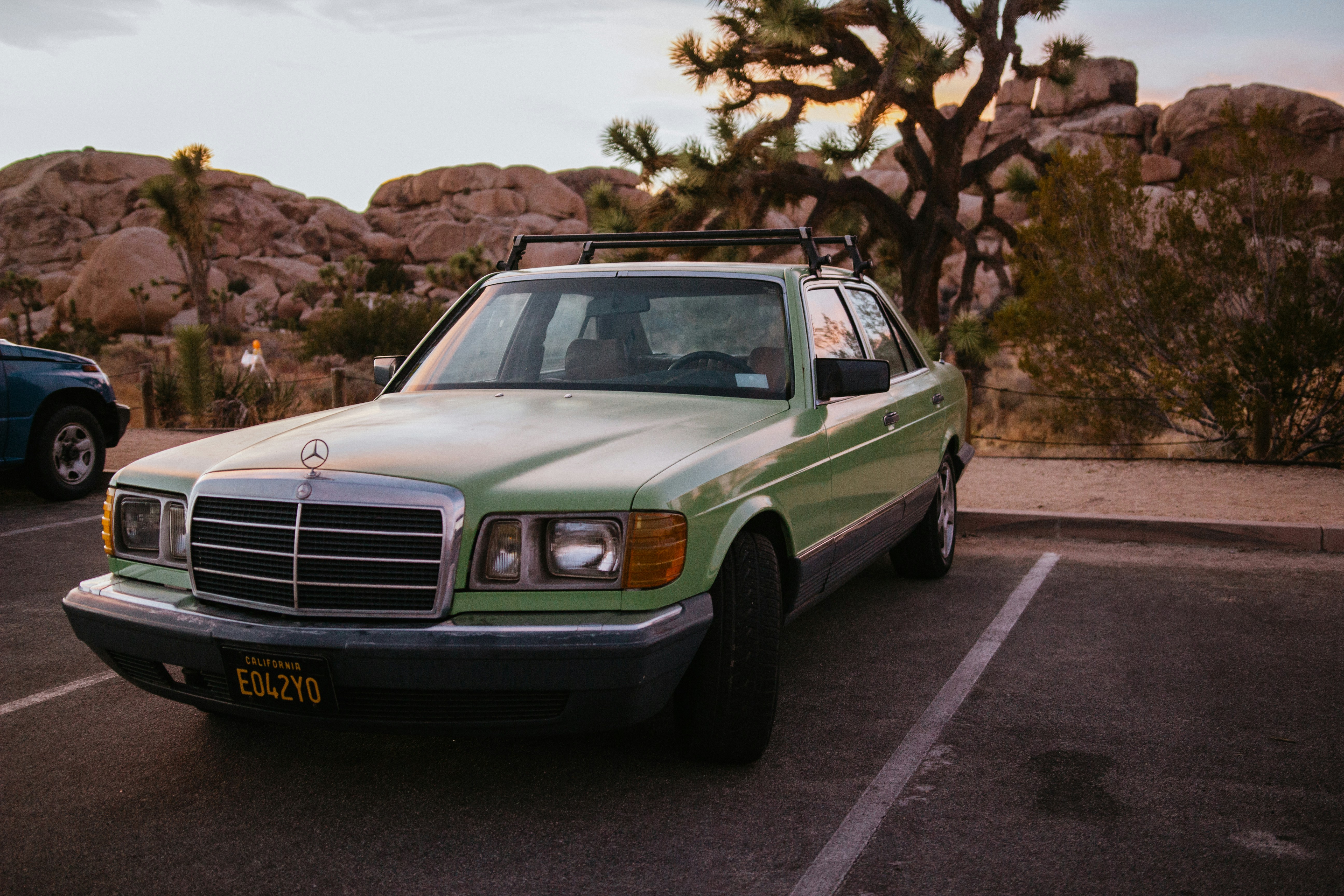 green and white chevrolet bel air parked on road during daytime