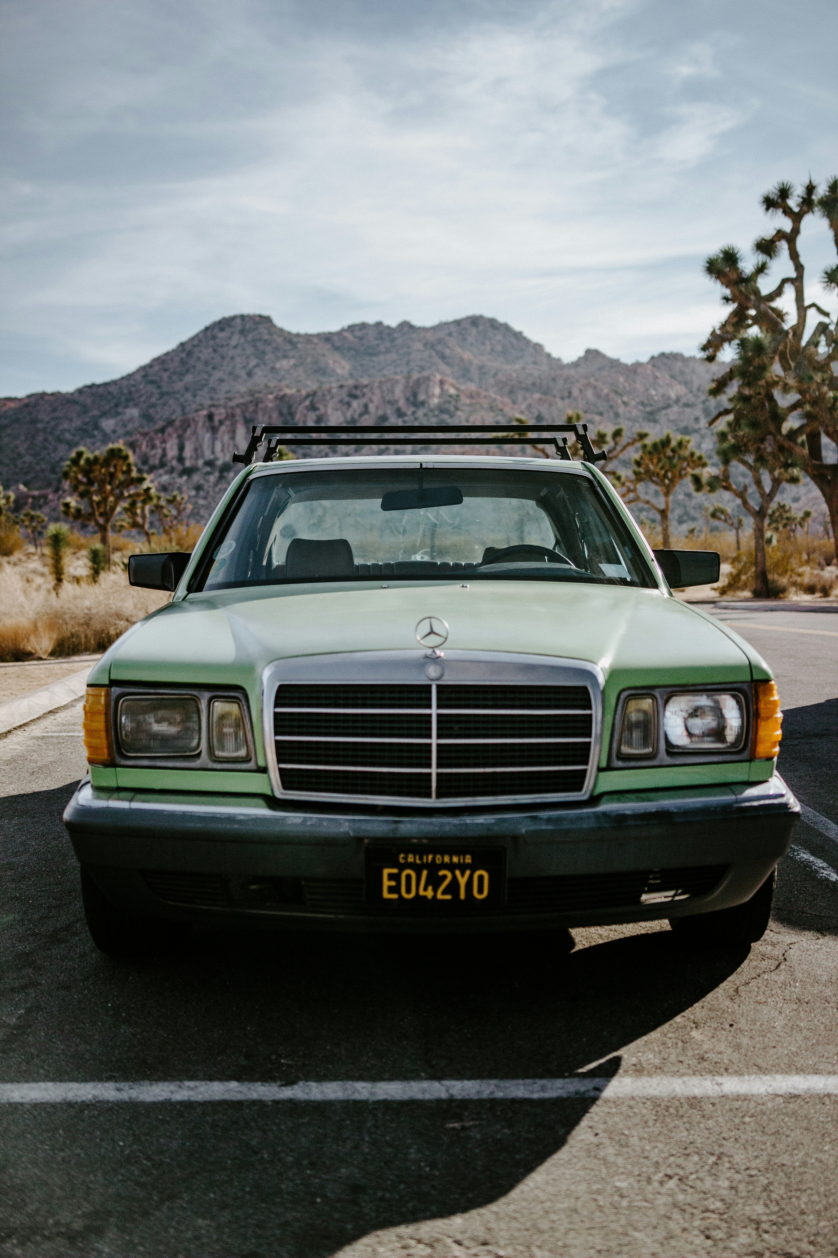 silver mercedes benz car on brown field during daytime