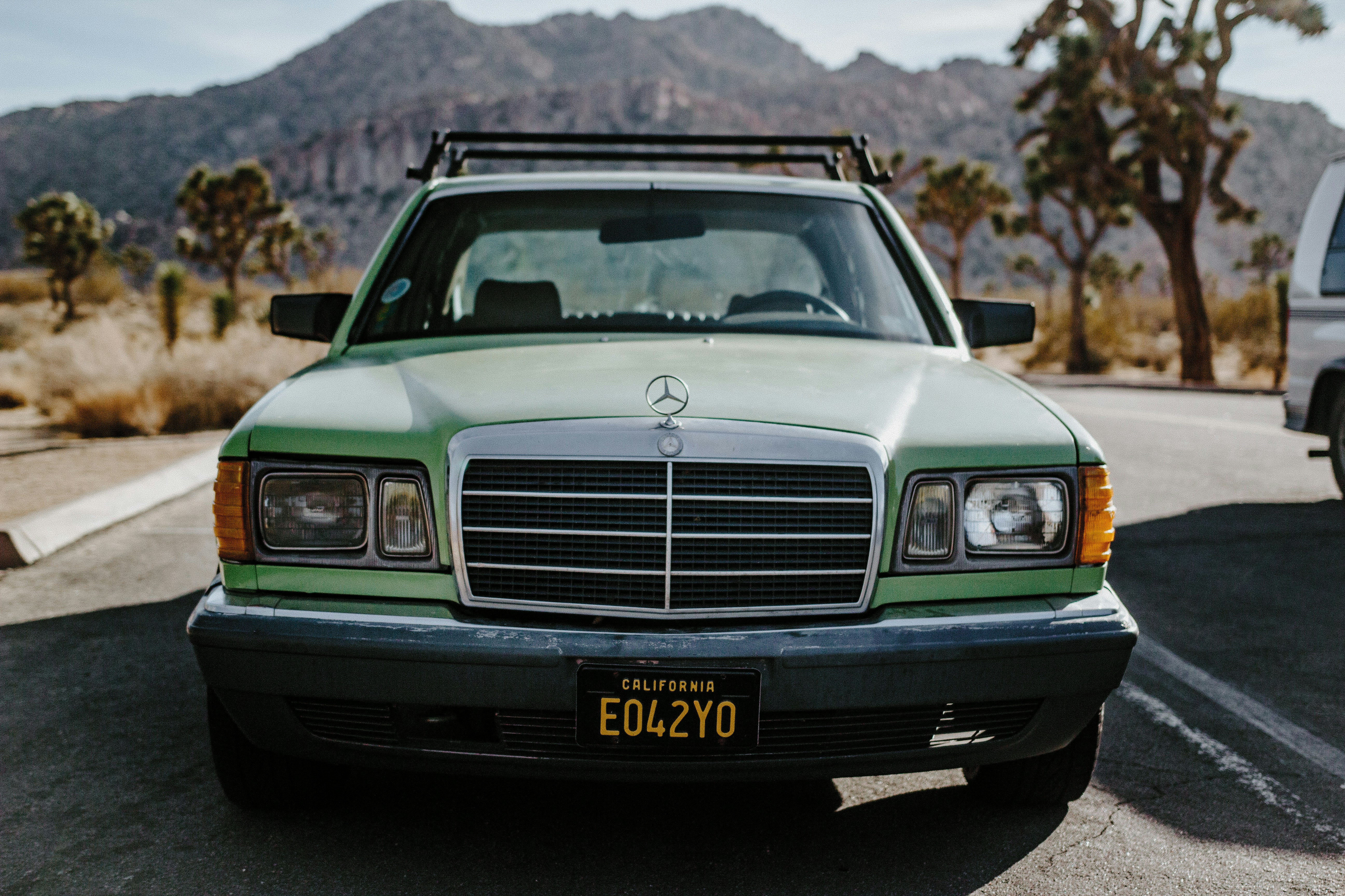 white mercedes benz car on road during daytime