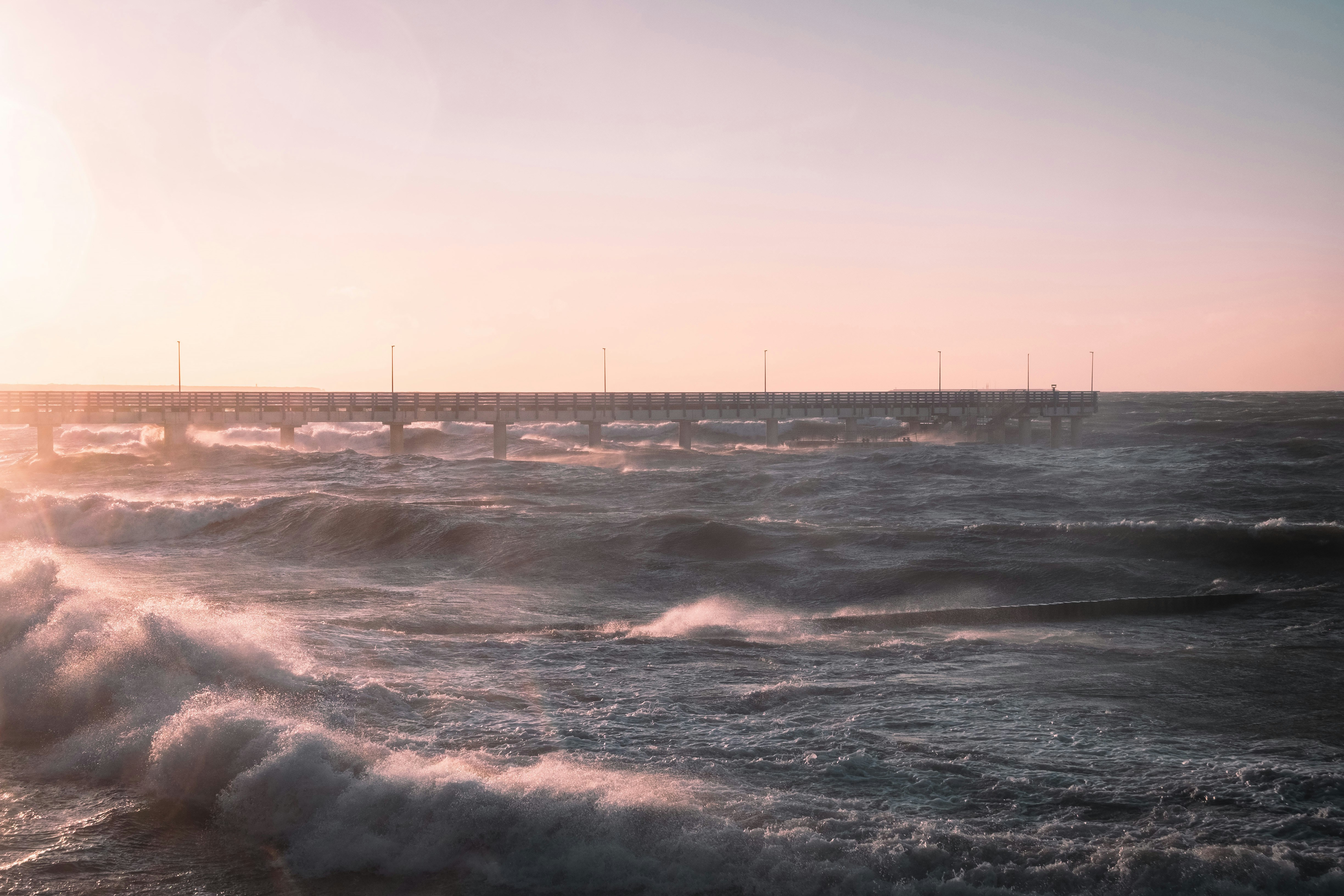sea waves crashing on shore during daytime, Sea storm at sunset</p><p>
