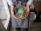 A man in workout clothes preparing a healthy grain bowl in his home kitchen.