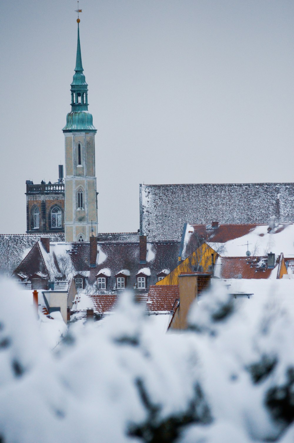 brown and white concrete building covered with snow