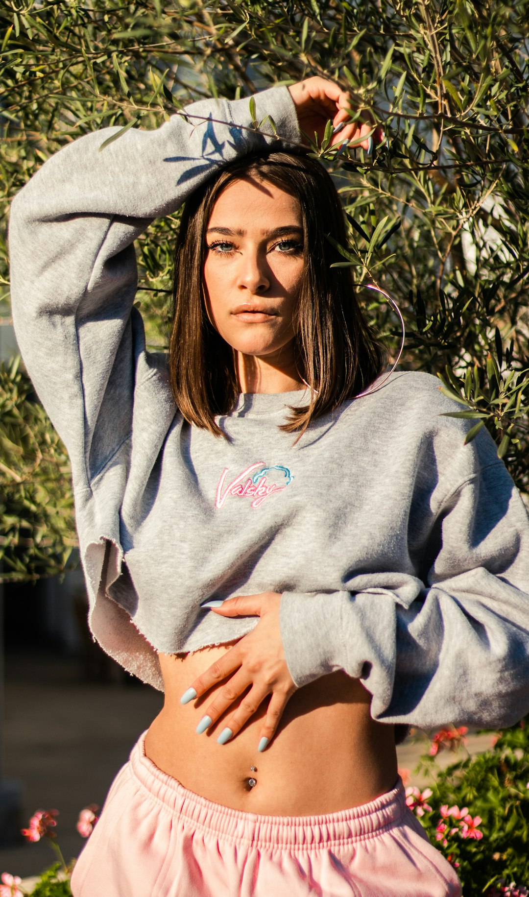 woman in gray hoodie smiling