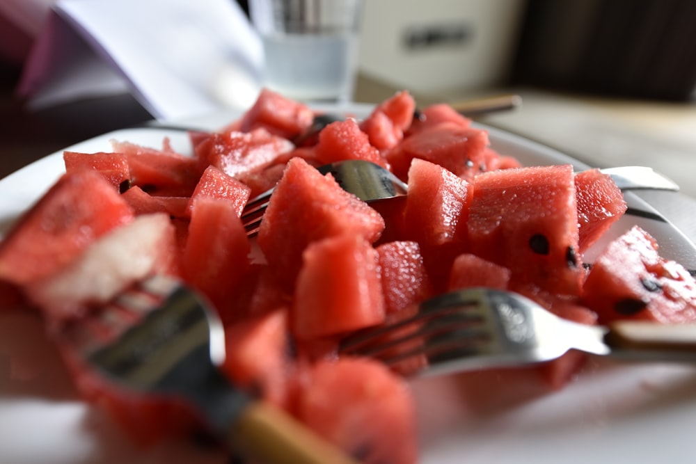 sliced watermelon on white chopping board
