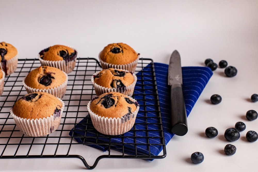 brown cupcakes on black metal rack