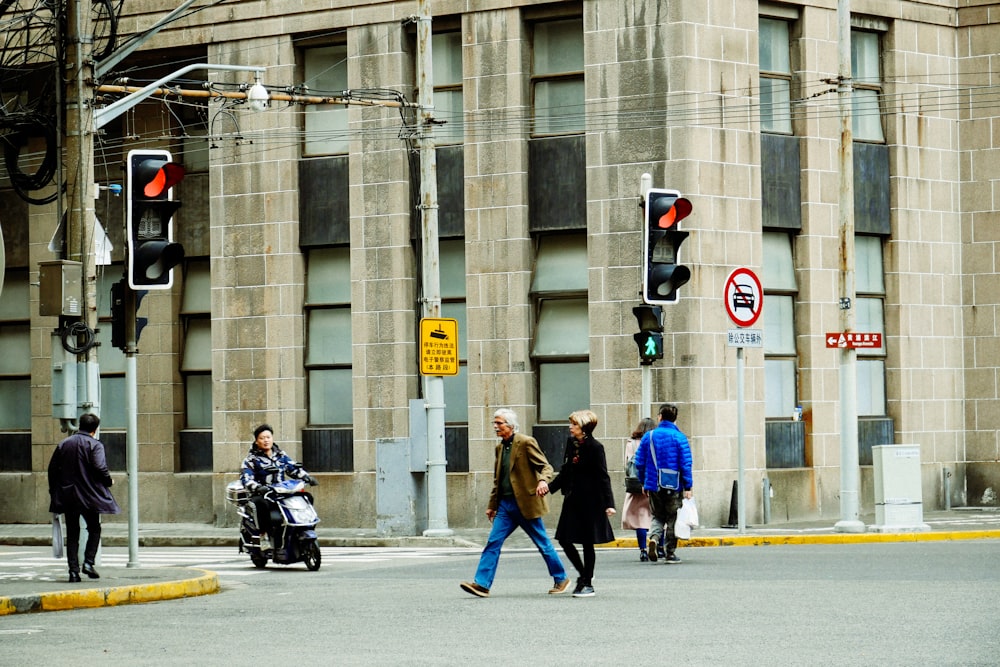 people walking on sidewalk during daytime