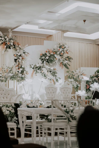 white wooden table with chairs