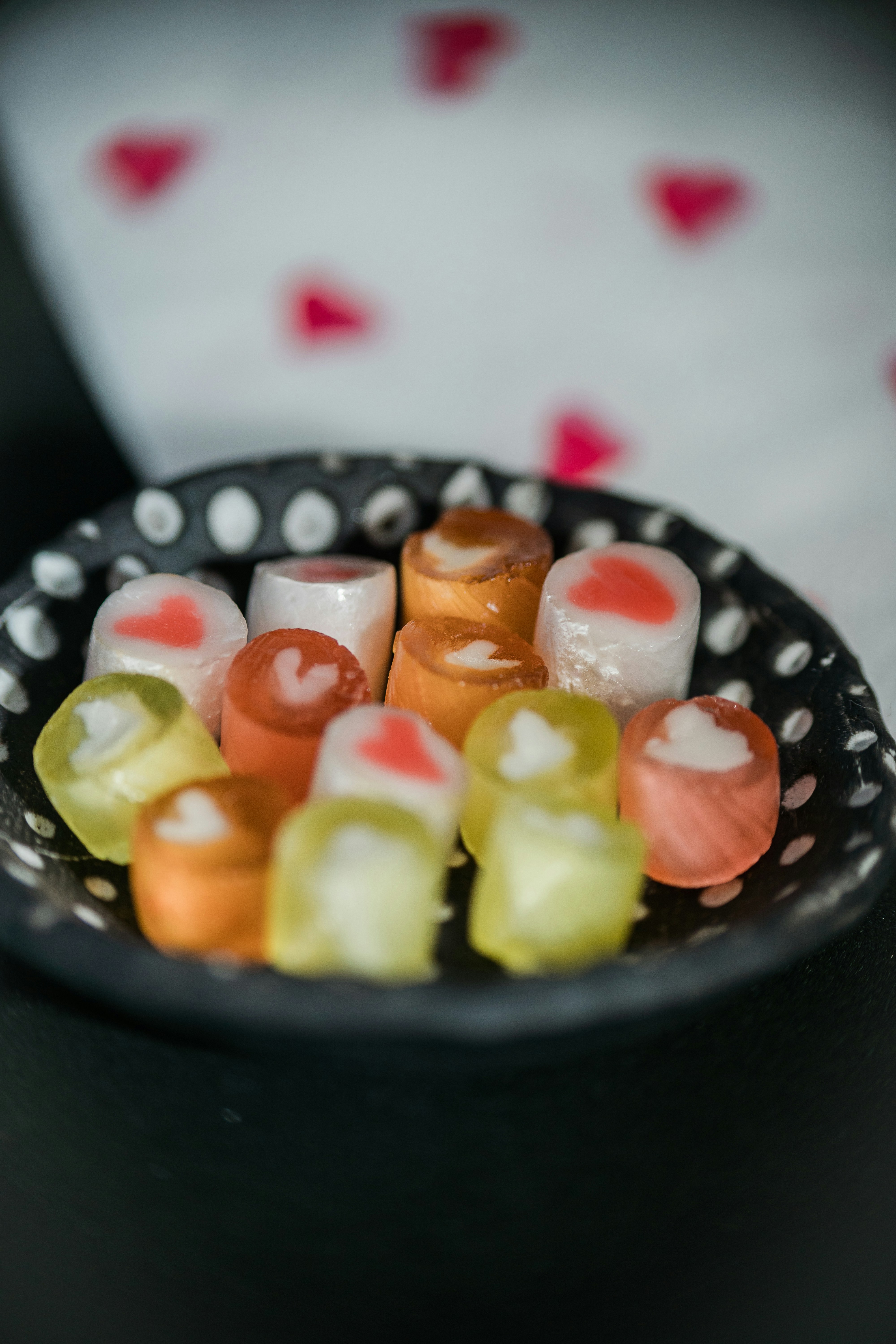 A handmade dish of small heart-themed candy