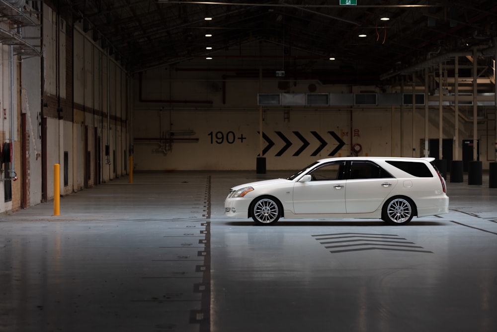 white sedan parked in garage