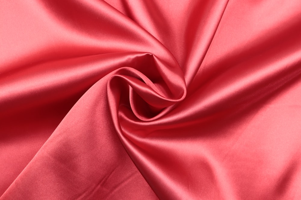 red textile in close up photography