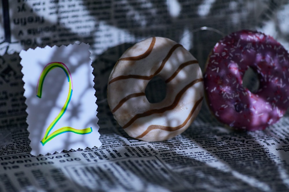 brown and white donut on white textile