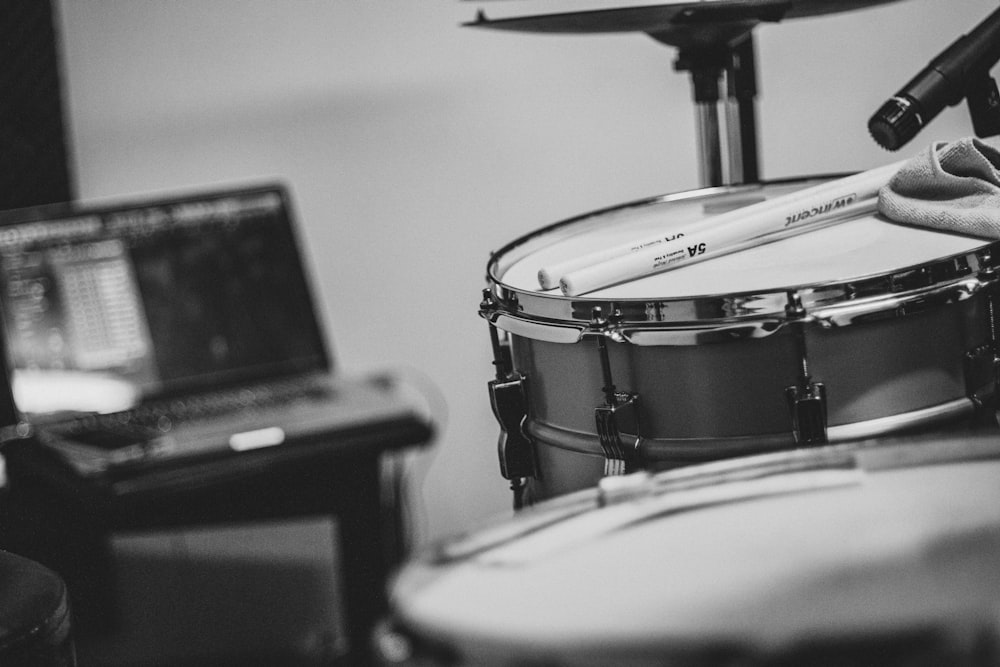 grayscale photo of drum kit