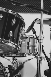 grayscale photo of drum set