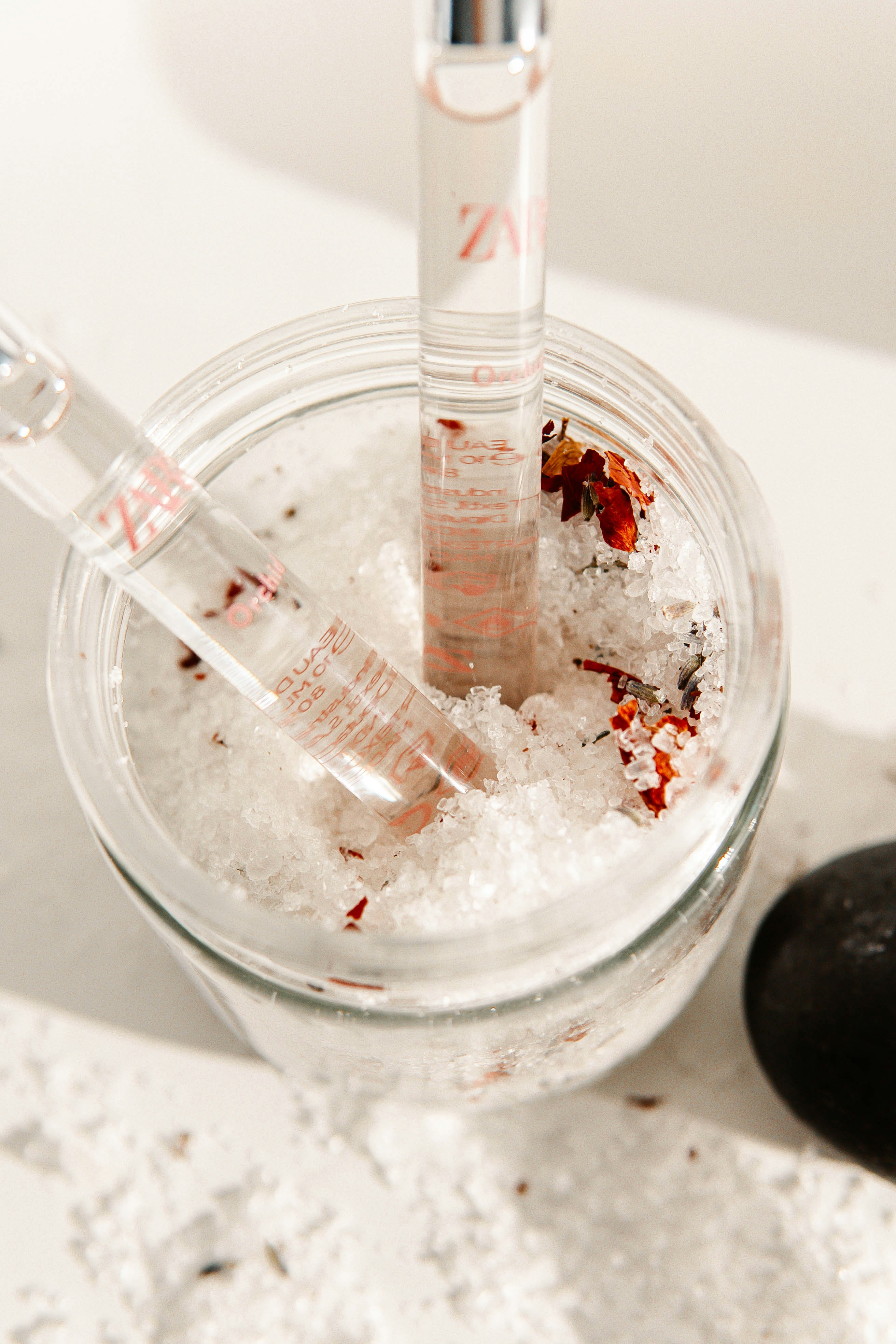 clear glass cup with red liquid