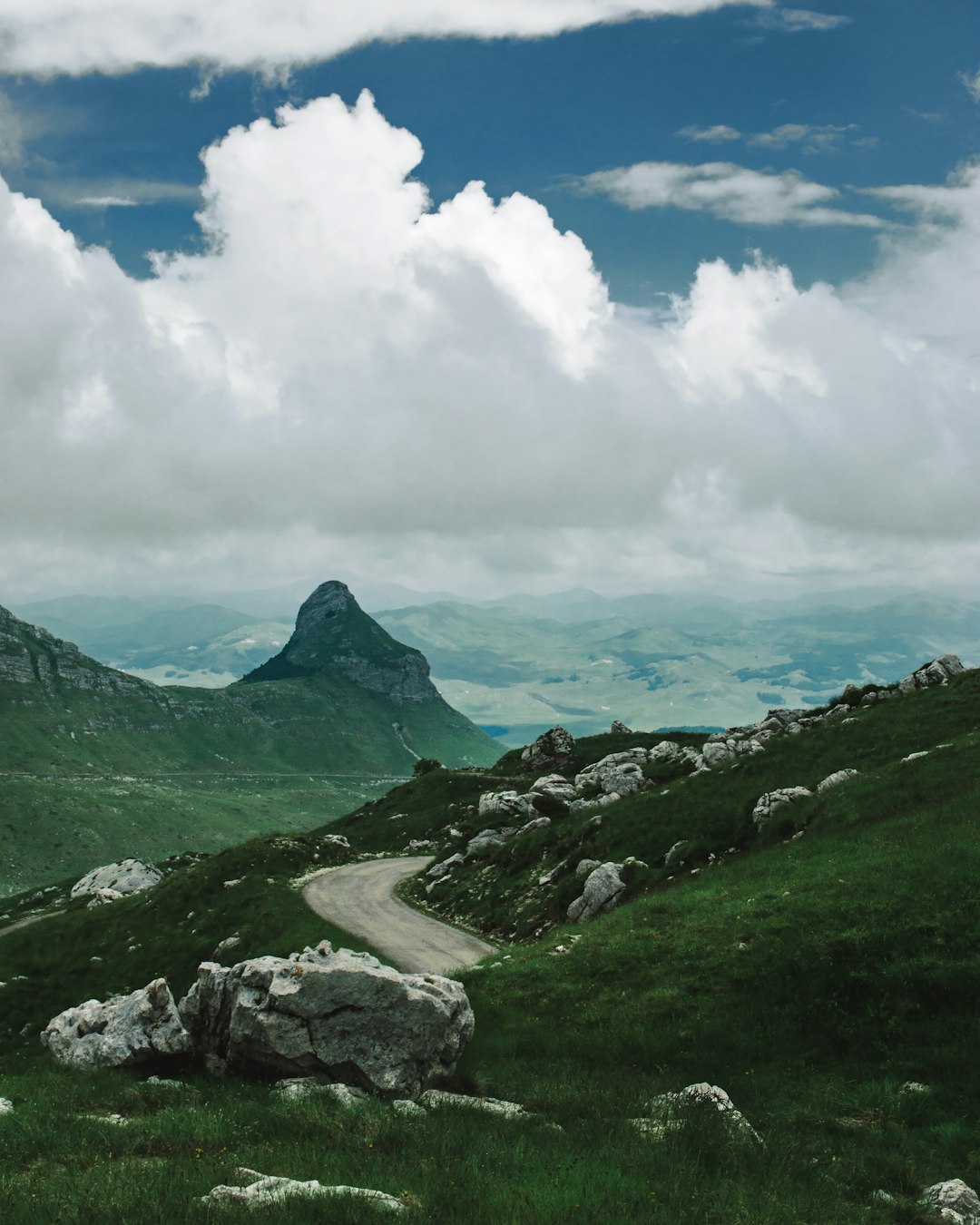 green mountains under white clouds during daytime