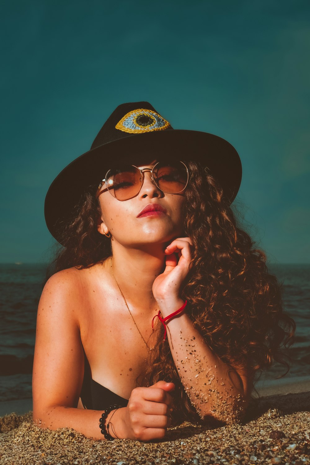 woman in black sun hat and sunglasses