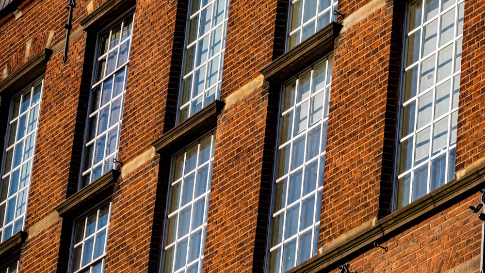 brown brick building with glass windows