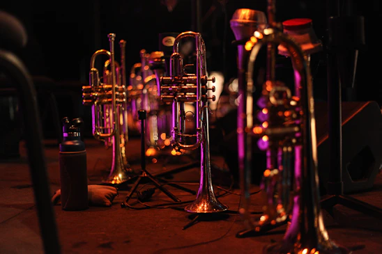 Felix Ponce performing with his trombone in a warmly lit Chicago jazz venue, surrounded by vintage instruments and subtle brass tones.
