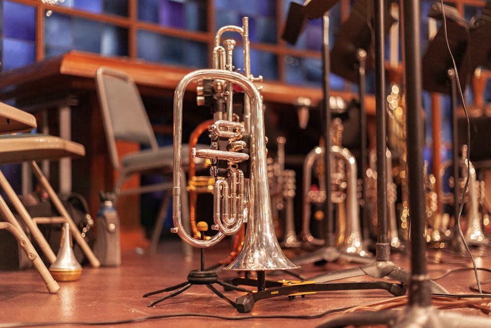 brass trumpet on brown wooden table