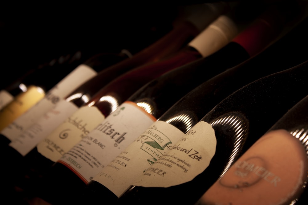 white labeled bottles on brown wooden table