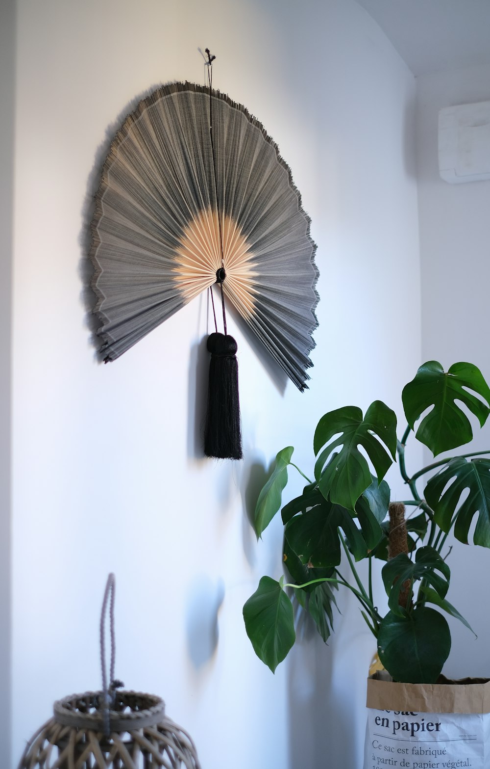 brown and black hand fan