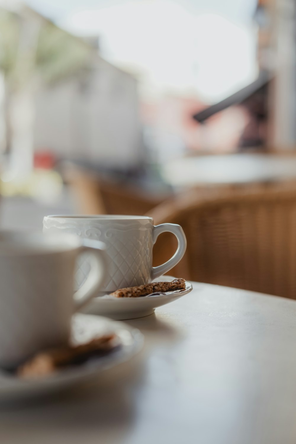 white ceramic mug on saucer