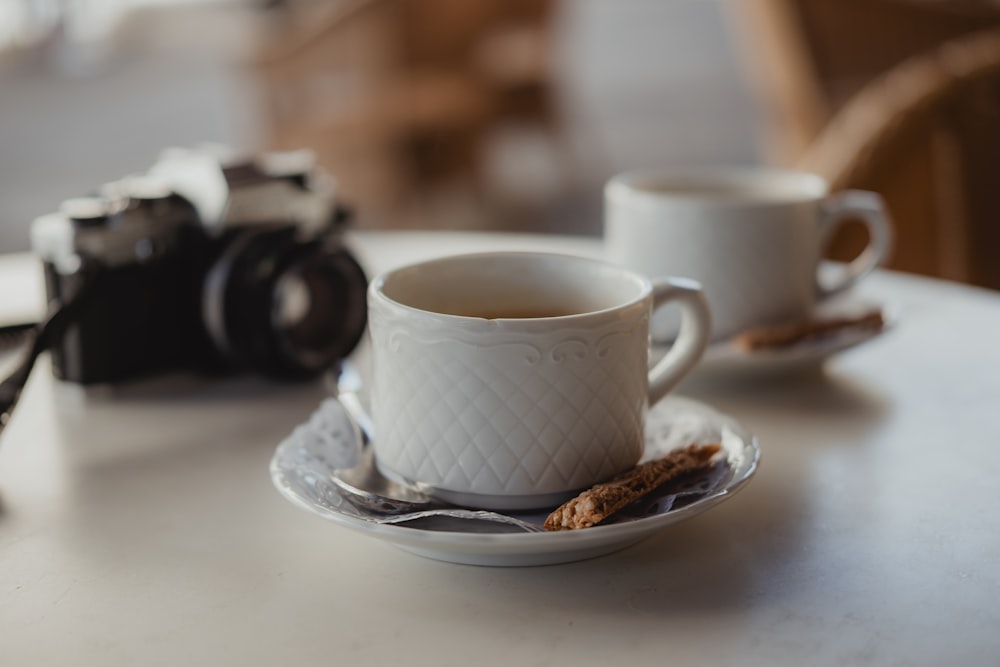 white ceramic mug on white ceramic saucer