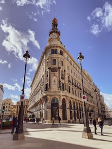 people walking on street near brown concrete building during daytime