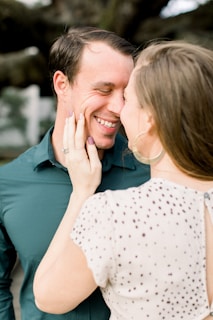 A couple sharing a heartfelt moment with their custom video message.