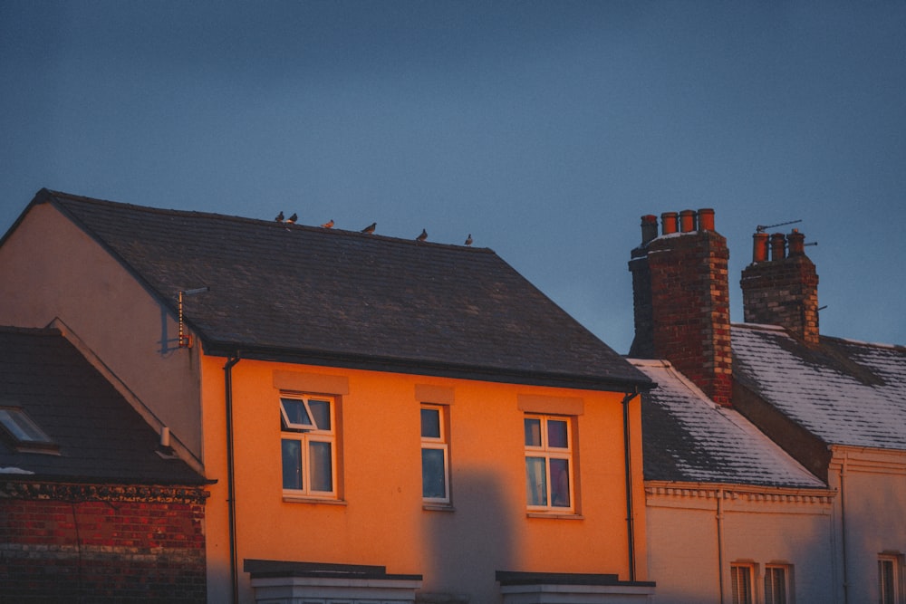 yellow and brown concrete house under blue sky during daytime