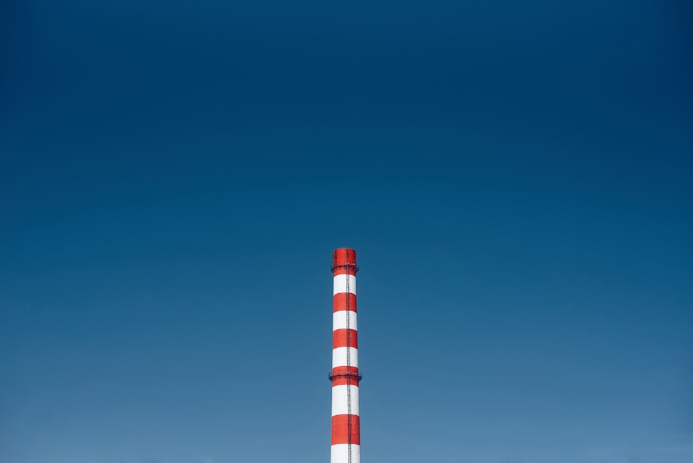 red and white tower under blue sky during daytime