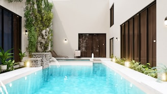 swimming pool near green trees during daytime