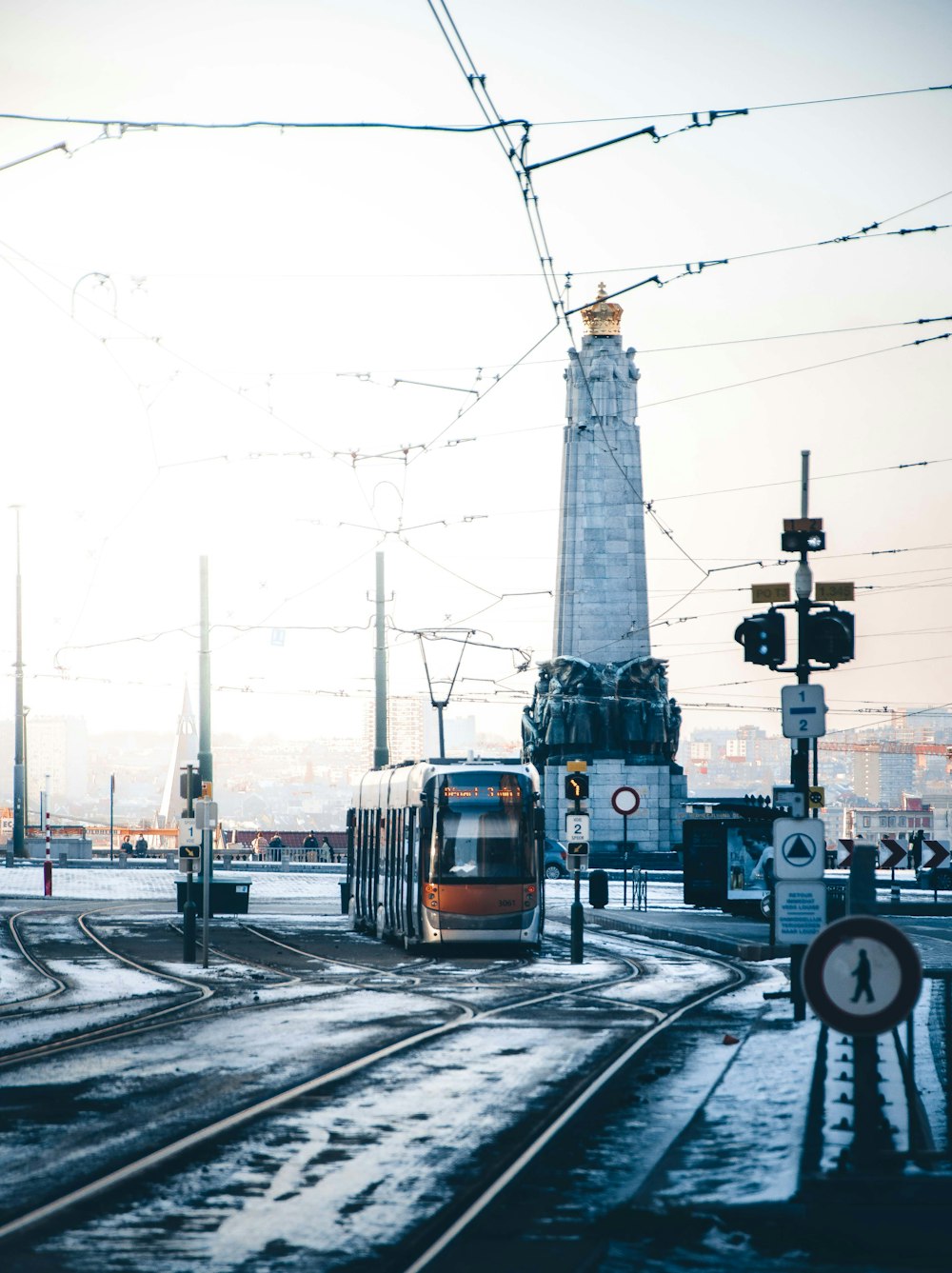 white and red train on rail road during daytime