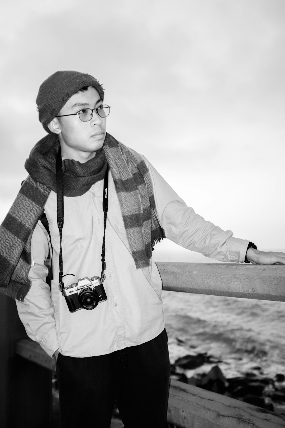 man in black and white scarf and white long sleeve shirt