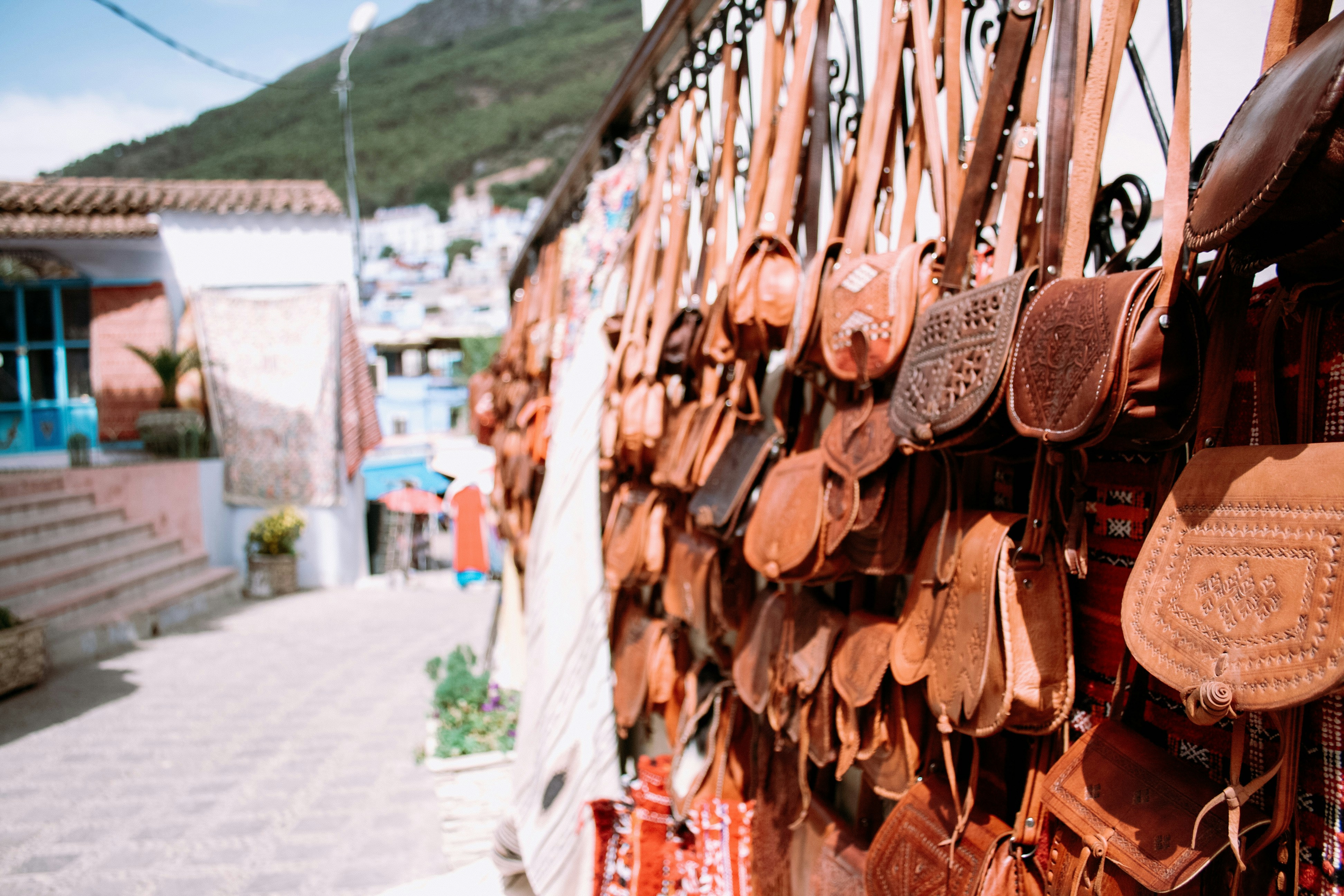 woman wearing yellow long-sleeved dress under white clouds and blue sky during daytime