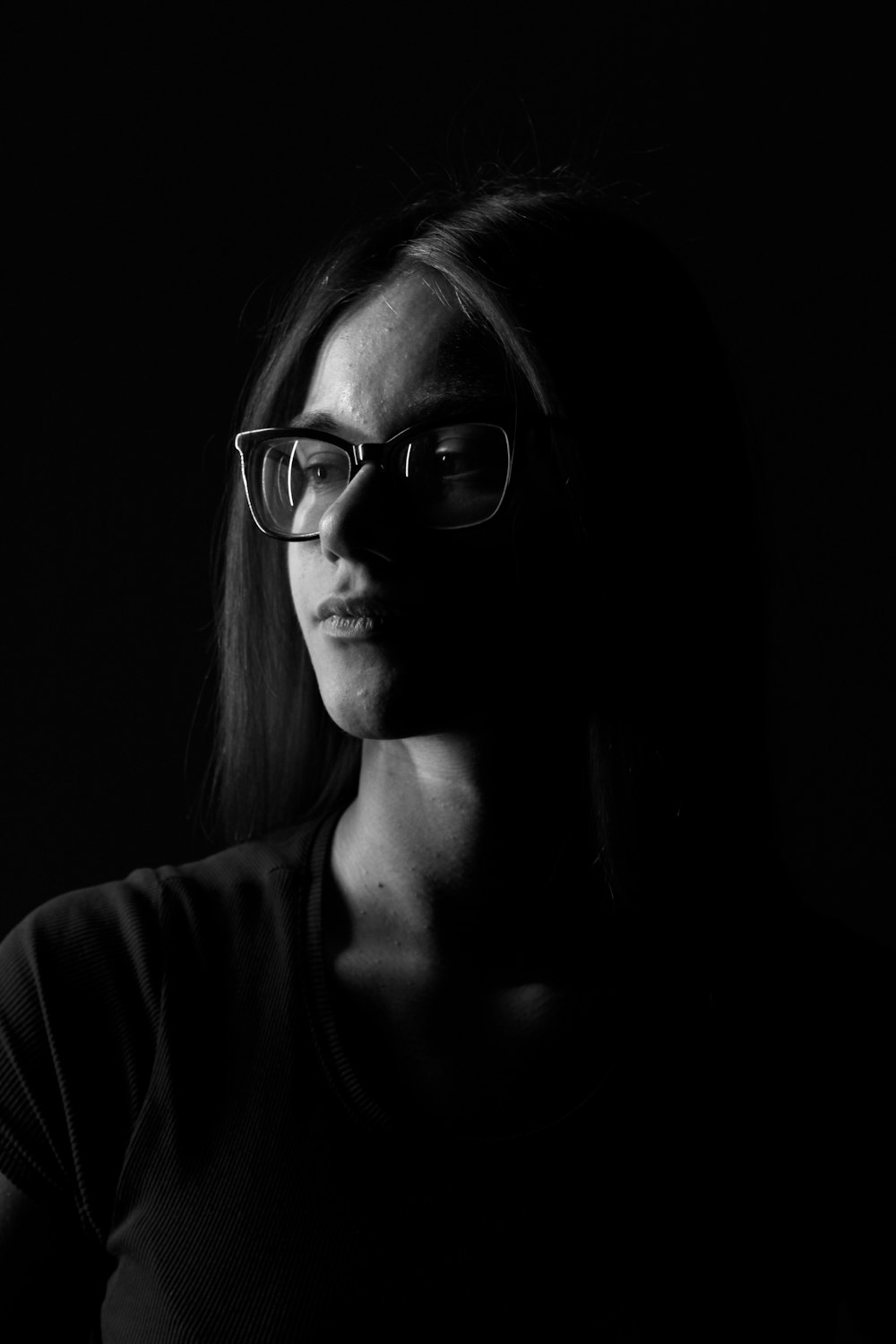 woman wearing black framed eyeglasses