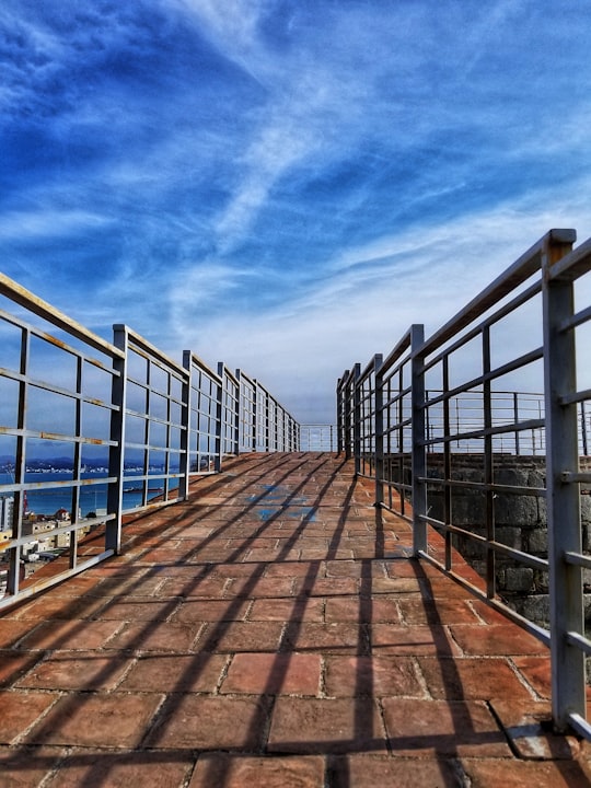 brown wooden dock under blue sky during daytime in Durrës Albania