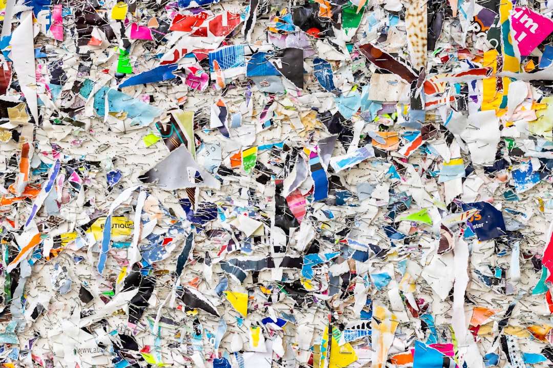 blue red and yellow paper boats on ground