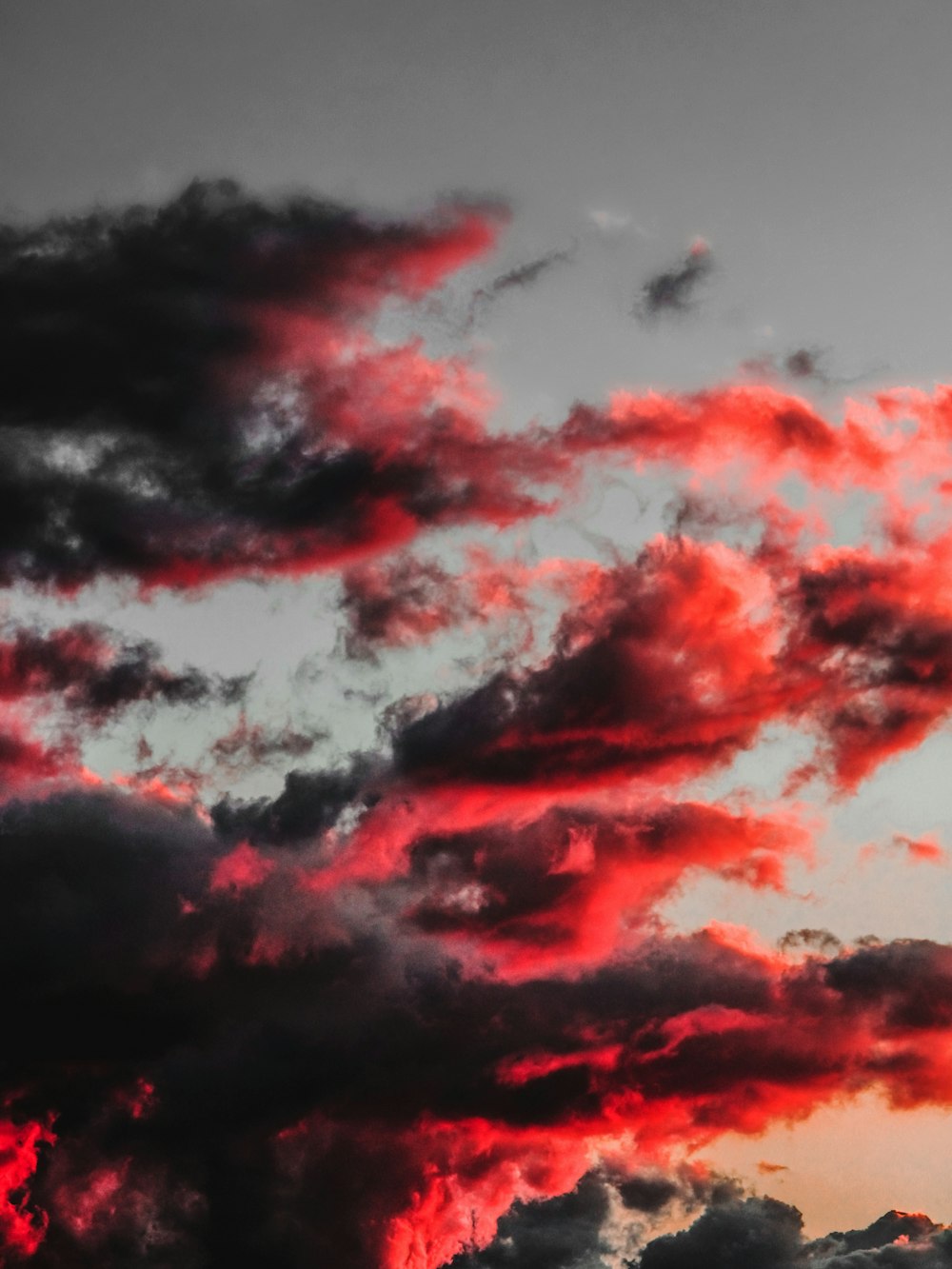 red and black clouds during daytime