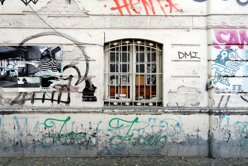 black motorcycle parked beside white wall