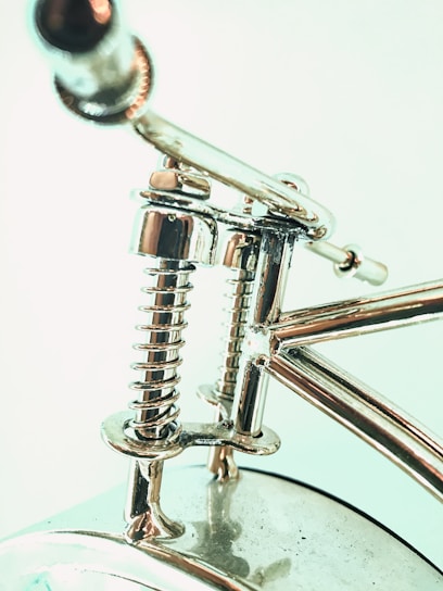 Close-up of a chrome plated piston rod gleaming under industrial lighting.