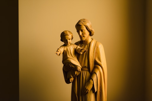 gold statue of man and woman